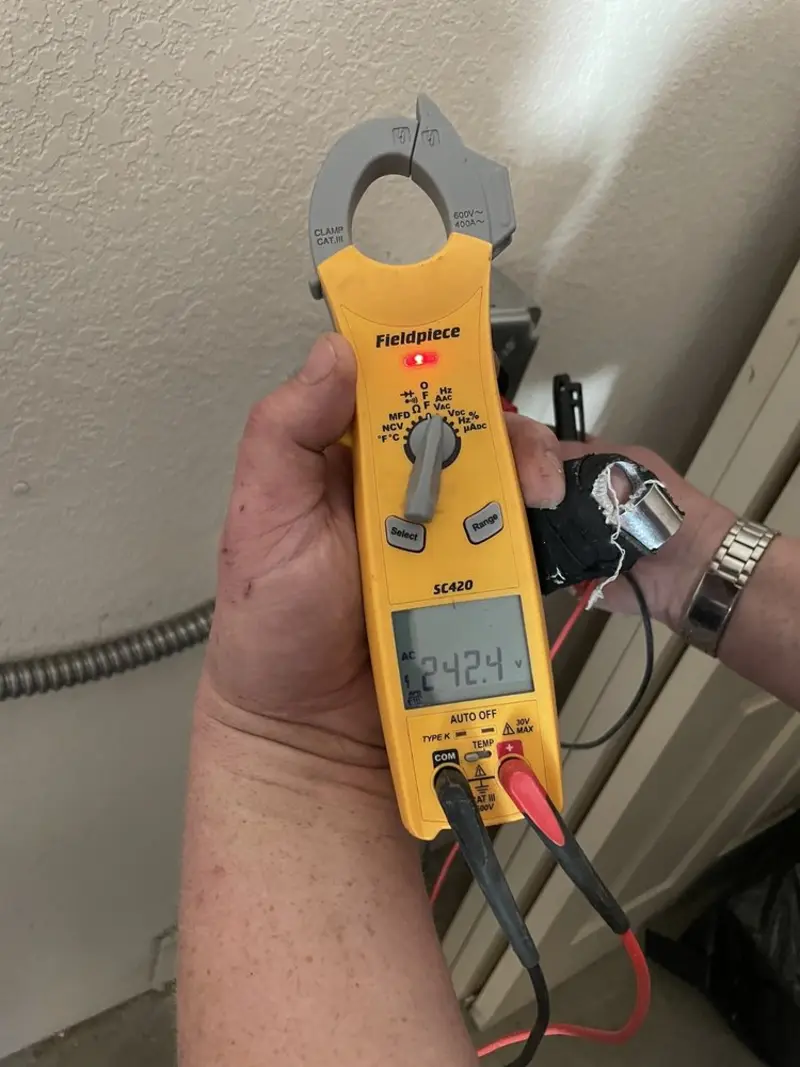 Voltage testing with clamp meter during Ceiling Fan Installation in Bellmawr